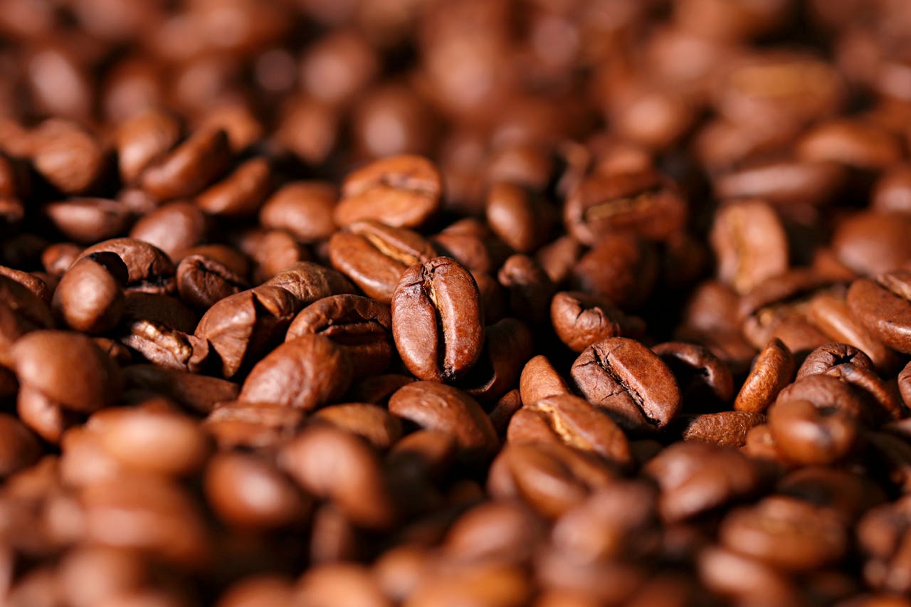 Detailed image of aromatic roasted coffee beans, perfect for caffeine lovers.